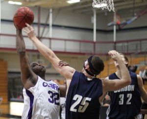 AJ Stephens (32) and David Dempsey (25) in action under the basket