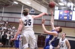 Hans Miersma (CCC Defensive Player of the Year) blocks the shot of Mike Engemann