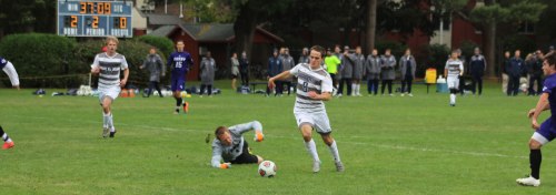Evan Crocker (2 goals) dribbles past Curry GK Dan Johnson and into an clear look at the Curry goal.